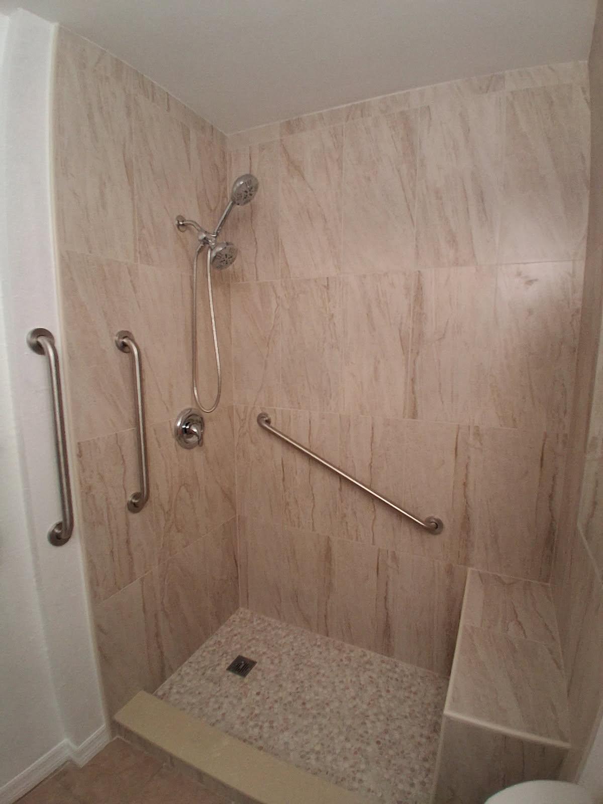 Walk-in shower with large-format marble tile and grab bars — custom shower installation Spring Hill Brooksville FL